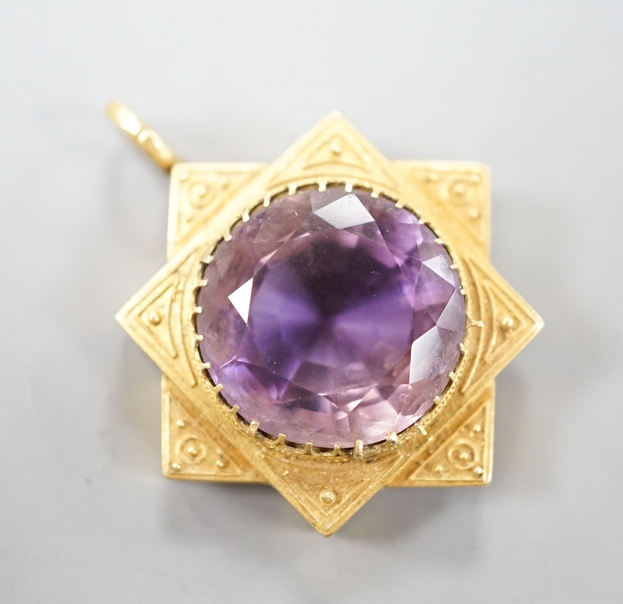 A late Victorian yellow metal and amethyst set pendant, 35mm, gross 7.5 grams.